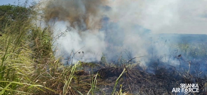 SLAF ASSISTS
IN EXTINGUISHING FOREST FIRE NEAR HAMBANTOTA NEW DISTRICT HOSPITAL