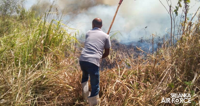 SLAF ASSISTS
IN EXTINGUISHING FOREST FIRE NEAR HAMBANTOTA NEW DISTRICT HOSPITAL