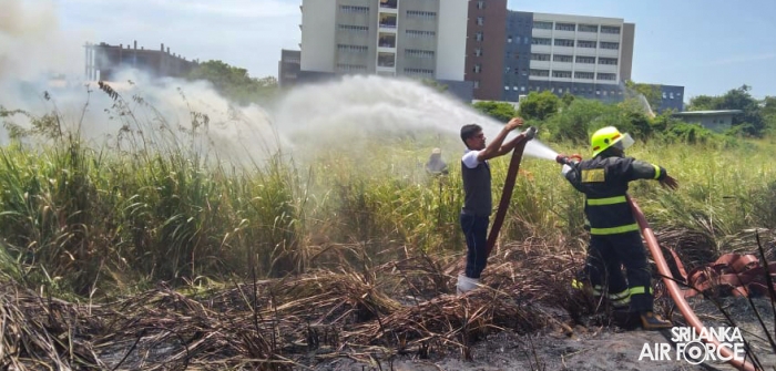 SLAF ASSISTS
IN EXTINGUISHING FOREST FIRE NEAR HAMBANTOTA NEW DISTRICT HOSPITAL