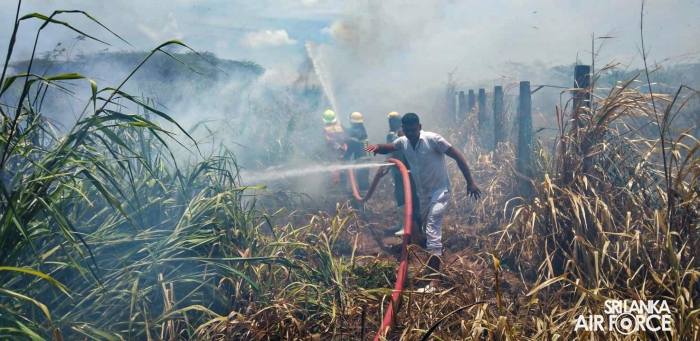 SLAF ASSISTS
IN EXTINGUISHING FOREST FIRE NEAR HAMBANTOTA NEW DISTRICT HOSPITAL