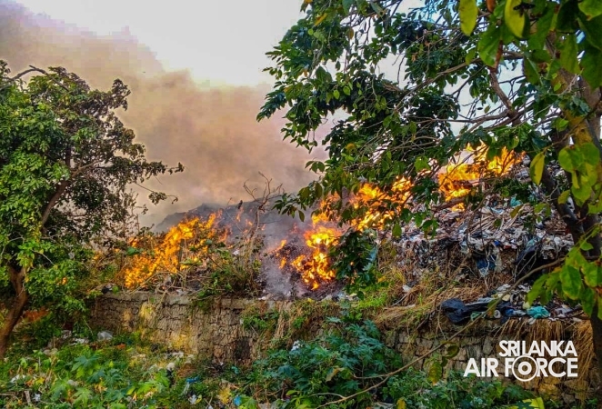 SLAF FIREFIGHTERS ASSIST IN CONTAINING GARBAGE DUMP FIRE IN PUTTALAM
